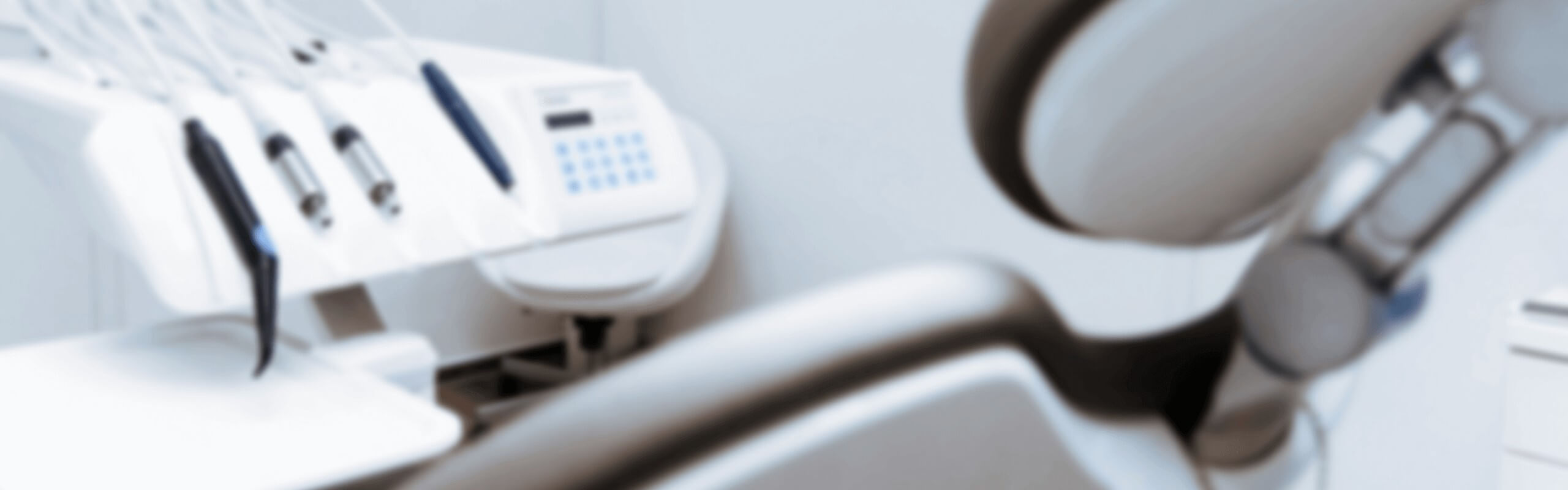 A dental chair facing towards some dental equipment at our dental practice here at Stella Dental, Stafford.