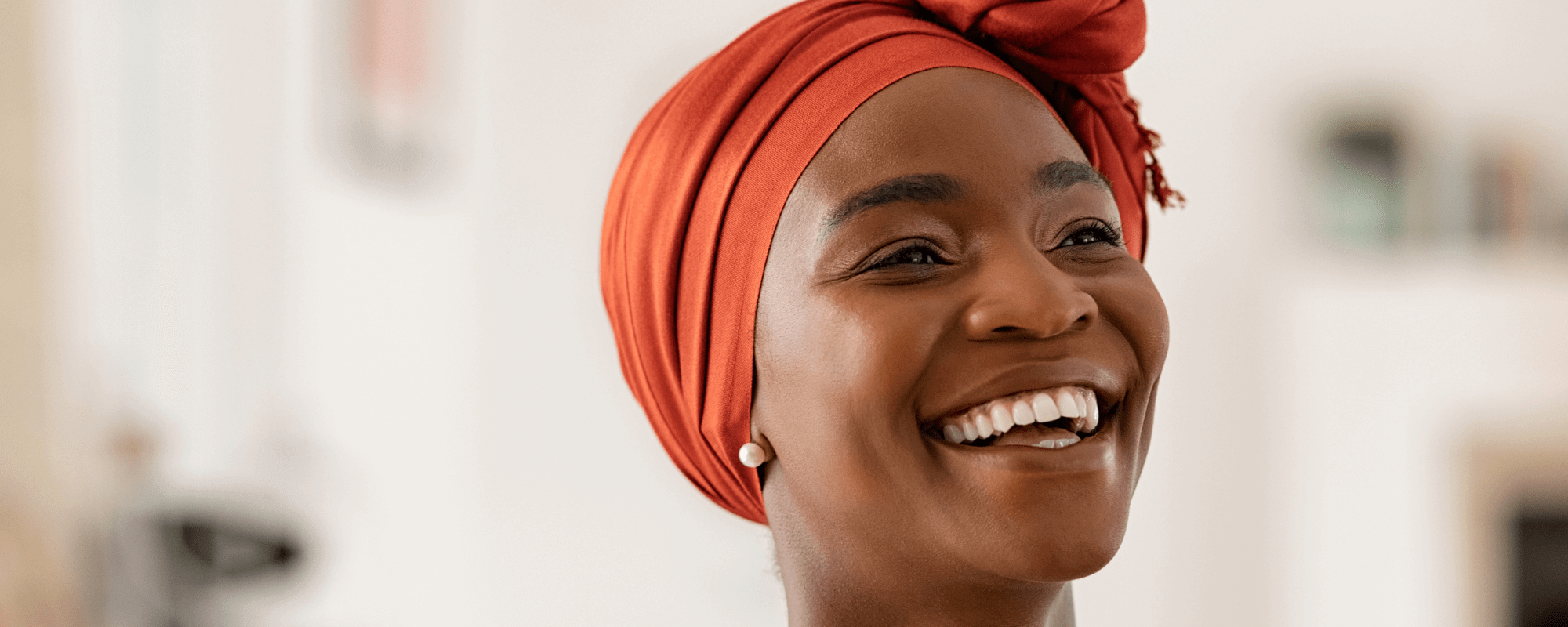 Woman wearing invisalign aligners and smiling after teeth whitening