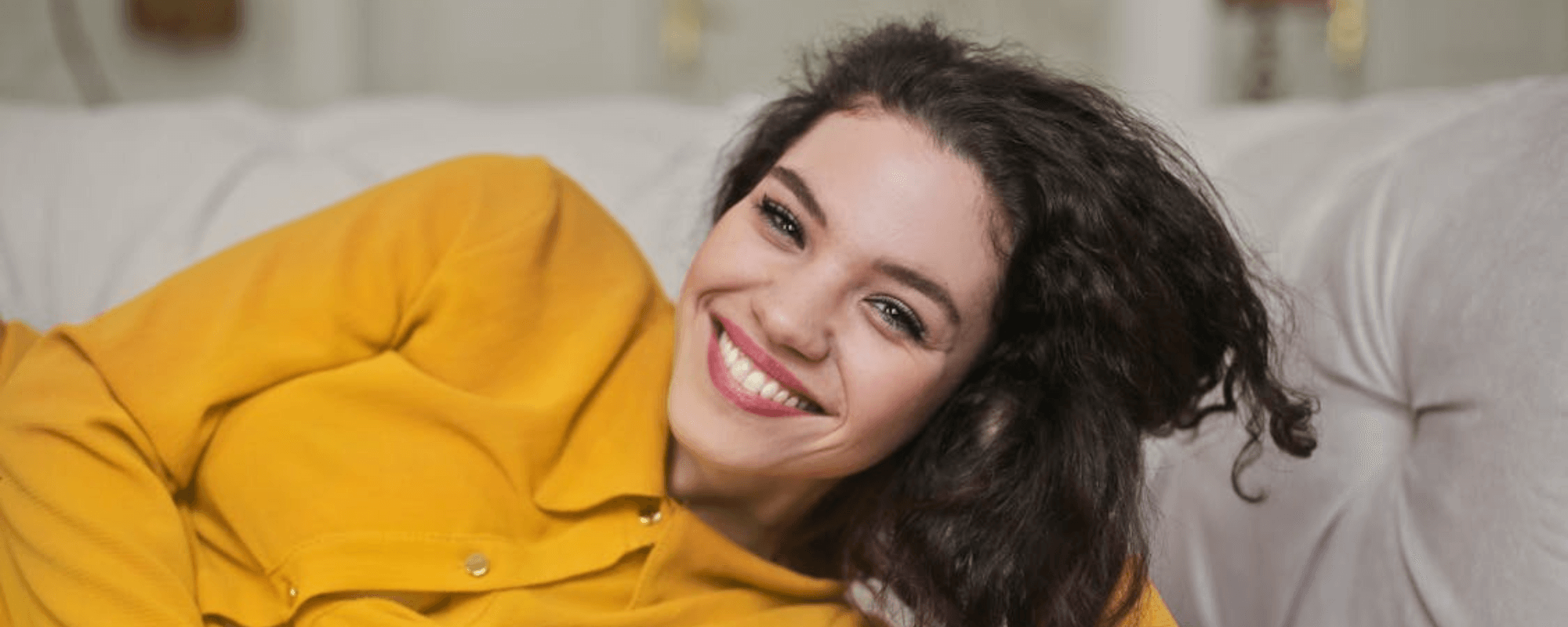 woman smiling after having tooth implants at stella dental in stafford