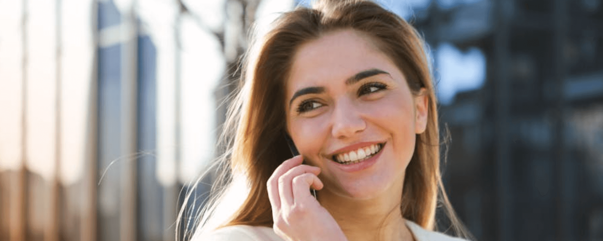 woman wearing invisalign aligners after beginning her invisalign journey at stella dental in stafford